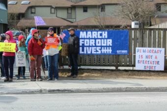 Protesters gather outside the Juneau offices of Sens. Lisa Murkowski and Dan Sullivan.