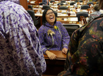 Rep. Tiffany Zulkosky, D-Bethel, greets friends and family standing in the Peratrovich Gallery of the Alaska State Capitol on March 9, 2018. The House speaker had just sworn her in as the newest member of the Alaska House of Representatives.