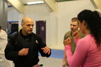 Eduardo Rocha returned to Sitka to teach a Brazilian jiu-jitsu workshop at Sitka’s Hames Center. He’s operated a gym in Oakland, California, since 2011. Rocha was the first person outside the Gracie family given permission to open a gym in the Brazilian family’s name. He is pictured here with students at last year’s workshop. (Photo by Emily Kwong/KCAW)