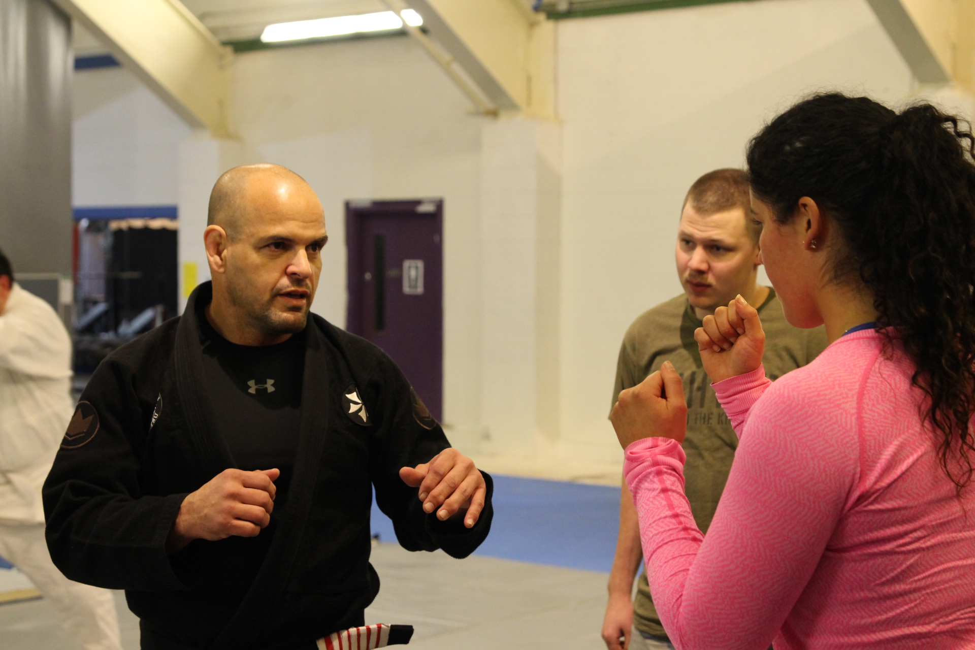 Eduardo Rocha returned to Sitka to teach a Brazilian jiu-jitsu workshop at Sitka’s Hames Center. He’s operated a gym in Oakland, California, since 2011. Rocha was the first person outside the Gracie family given permission to open a gym in the Brazilian family’s name. He is pictured here with students at last year’s workshop. (Photo by Emily Kwong/KCAW)
