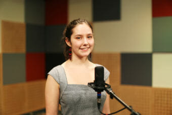 Juneau student Morgan Blackgoat stands on the @360 stage before the Poetry Out Loud state final competition in Juneau, Alaska.