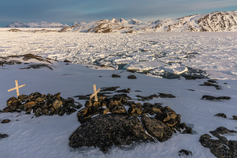 Graves under stones on a small hill near Kulusuk, Greenland. (Photo courtesy Markus Trienke)