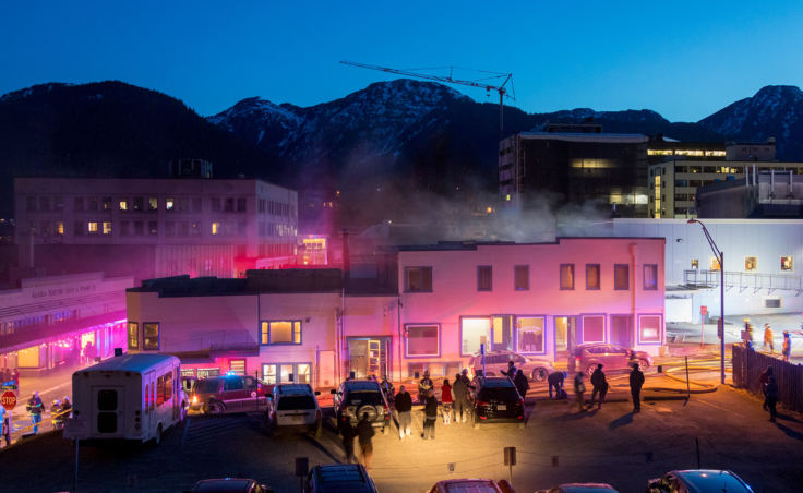 Capital City Fire/Rescue fights a fire in the 200 block of North Franklin Street on the evening of Monday, April 16, 2018. (Photo by Mikko Wilson/KTOO)