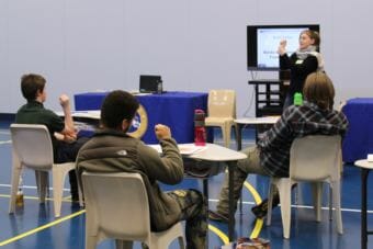 Volunteer Aurah Landau leads Johnson Youth Center residents in a mindfulness exercise during the 2018 Transition Camp. (Photo by Adelyn Baxter/KTOO)