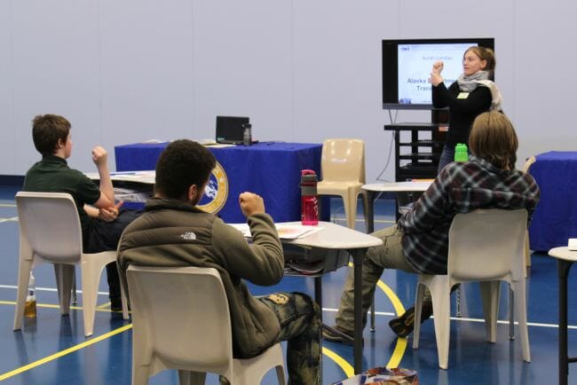 Volunteer Aurah Landau leads Johnson Youth Center residents in a mindfulness exercise during the 2018 Transition Camp. (Photo by Adelyn Baxter/KTOO)