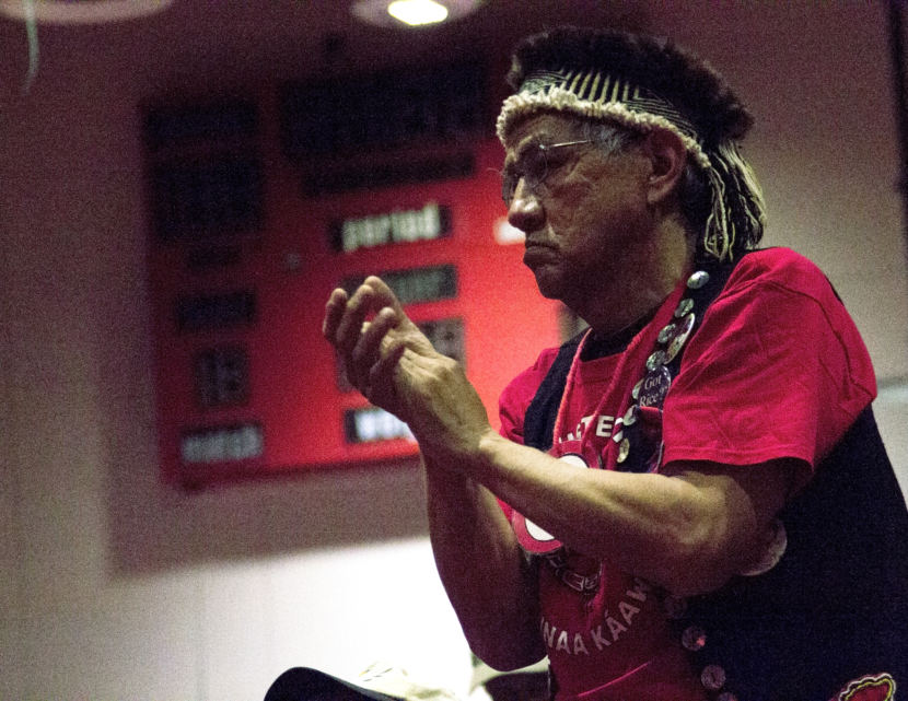 Stuart Mills claps during a performance at the 29th annual Heritage Celebration Ku.éex' on Friday, April 27, 2018, at Hoonah School. (Photo by Tripp J Crouse/KTOO)