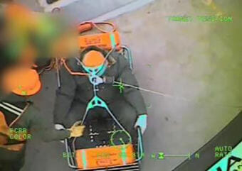 An Air Station Sitka helicopter man hoists a 61-year-old tugboat captain from the Maia H in Chatham Strait. The man was experiencing stroke symptoms and was medevaced to Sitka. (Video still courtesy U.S. Coast Guard)