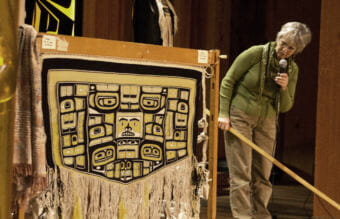 Dorica Jackson talks about a robe she spent almost 15 years working on during a weavers' presentation Wednesday, June 6, 2018, at the Shuka Hit clan house in the Walter Soboleff Building in downtown Juneau.