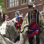 Various indigenous groups march and dance during a parade Saturday, June 9, 2018, in downtown Juneau, Alaska. (Photo by Tripp J Crouse/KTOO)