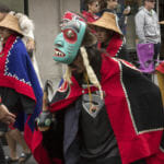 Various indigenous groups march and dance during a parade Saturday, June 9, 2018, in downtown Juneau, Alaska. (Photo by Tripp J Crouse/KTOO)