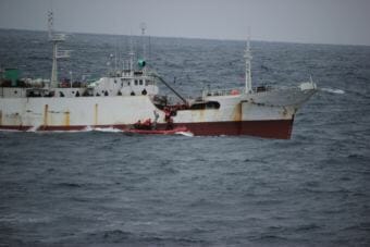 A USCGC Alex Haley boarding team boards the fishing vessel Run Da after the vessel was suspected of illegal high seas driftnet fishing in the North Pacific Ocean, 860 miles east of Hokkaido, Japan, June 16, 2018. (Photo courtesy of U.S. Coast Guard)