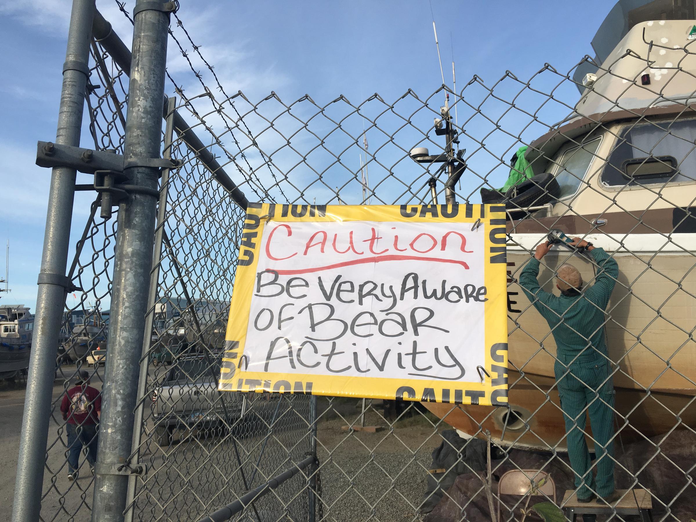 Hand-written sign in the upper lummy yard warning anyone passing by about bears wandering the area. (Photo by Mitch Borden/KMXT)
