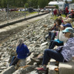 A group of people wait for the canoes to come to Douglas Harbor on Tuesday, June 5, 2018.