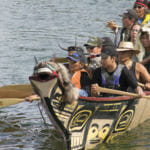 Paddlers canoe in Douglas Harbor on Tuesday, June 5, 2018.