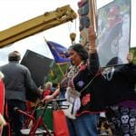 Members of the Yanyeidí clan dance in celebration around the new Gooch (wolf) totem pole at Savikko Park. June 6, 2018. (Photo by Adelyn Baxter/KTOO)