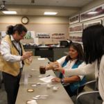 The judges get done scoring the seal oil with crackling. (Photo by Elizabeth Jenkins/Alaska's Energy Desk)
