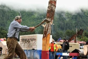 A competitor participates in the men's vertical chopping event on Sunday, June 17, 2018. (Photo by Adelyn Baxter/KTOO)