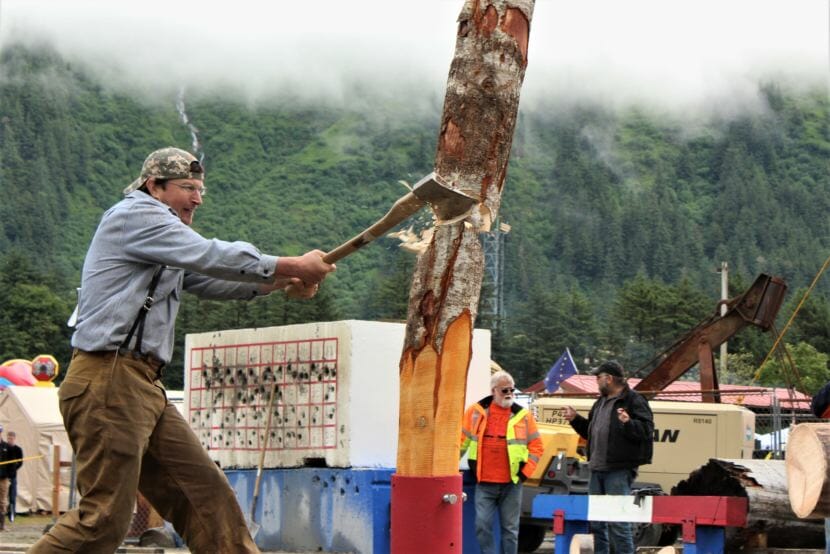 A competitor participates in the men's vertical chopping event on Sunday, June 17, 2018. (Photo by Adelyn Baxter/KTOO)