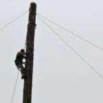 Ralph "Animal" Austin competes in the men's speed climbing event at Gold Rush Days on June 17, 2018. Competitors ascend a 50-foot log pole as quickly as possible.