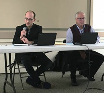 Ketchikan School Board President Trevor Shaw speaks during a school board meeting in Saxman. Also pictured is Superintendent Robert Boyle. (File photo by Leila Kheiry/KRBD)