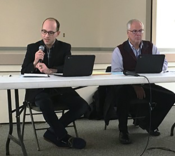 Ketchikan School Board President Trevor Shaw speaks during a school board meeting in Saxman. Also pictured is Superintendent Robert Boyle. (File photo by Leila Kheiry/KRBD)