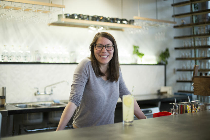 Amalga Distillery co-owner Maura Selenak uses spruce tips in their syrups, spruce tip soda, and Juneauper gin on Jul. 13, 2018. She says company has been using spruce tips from Pep’s Packing since they opened their business a little over a year ago. (Photo by Annie Bartholomew/KTOO)
