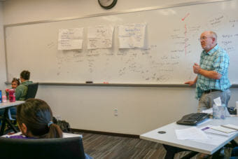 John Hersrud teaches a financial literacy class for Knik Tribal Council. (Photo by Anne Hillman/Alaska Public Media)