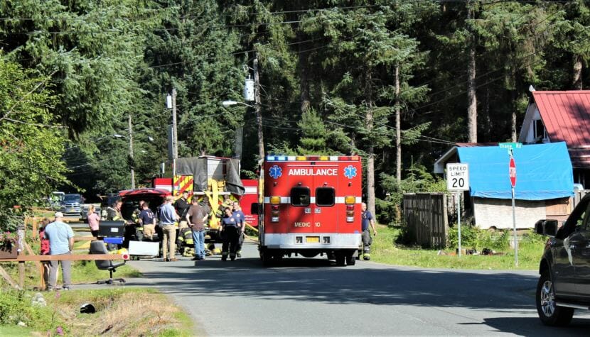 Fire crews evaluate the scene after a house fire was extinguished on Kimberly Street on July 20, 2018. (Photo by Adelyn Baxter/KTOO)