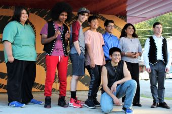 (From left to right) Teenagers Arturo Rodriguez, AJ Hoyle, Keegan Kanan, Bradley Dybdahl, Jacob Brouilette, Marcel Cohen and Kenndra Willard pose with Will Kronick from the Central Council of Tlingit and Haida on July 30, 2018. (Photo by Adelyn Baxter/KTOO)