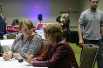 Anchorage Republican Rep. Gabrielle LeDoux sits at Election Central at the Dena’ina Center downtown Tuesday, August 21, 2018, while she waits for results in her closely-fought GOP primary with Aaron Weaver, a former cameraman at KTUU. (Photo by Nathaniel Herz/Alaska’s Energy Desk)
