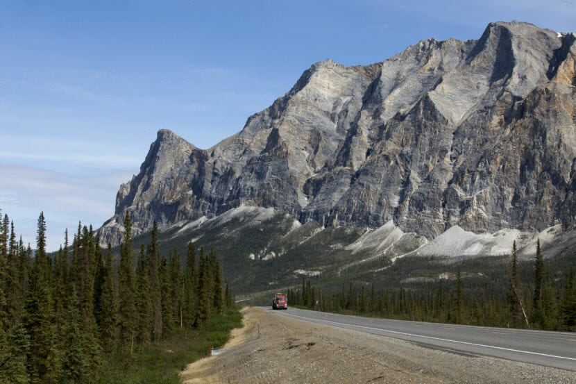 A truck makes its way south on the Dalton Highway near Coldfoot, Alaska. (Photo by Rashah McChesney/Alaska's Energy Desk)