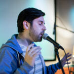 Lead vocalist Alejandro Chavarria of the band Revilla performs at the KXLL Showcase during the 2018 Alaska Folk Festival at the Hangar Ballroom. (Photo by Annie Bartholomew/KTOO)