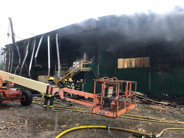 Capital City Fire/Rescue personnel fight a fire early Thursday at the former recycling center at the Juneau landfill. (Photo courtesy Fire Marshal Daniel Jager)
