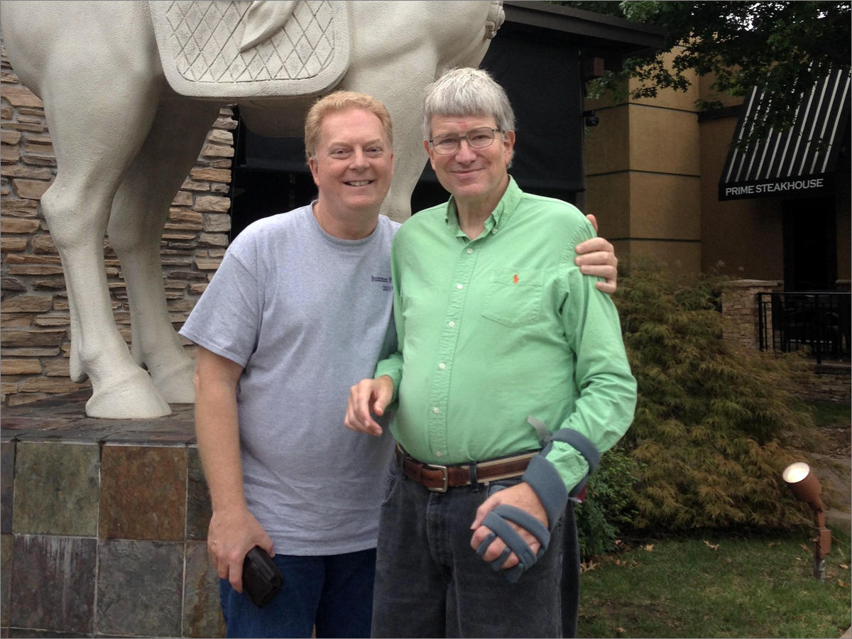 Paul Linnes, left, and his partner Michael Oakley, a patient at Brookhaven Hospital, at a Tulsa, Oklahoma, restaurant they often frequented for lunch. (Photo courtesy Paul Linnes)
