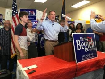 Former U.S. Sen. Mark Begich announces that he's staying in the race for governor in Anchorage on Tuesday, the deadline for candidates to withdraw and have their names taken off the ballot. Also pictured: His son Jacob Begich, wife Deborah Bonito and lieutenant governor running mate Debra Call.  The three-way race includes Gov. Bill Walker, an independent, former state Sen. Mike Dunleavy, a Republican, and Begich, a Democrat.