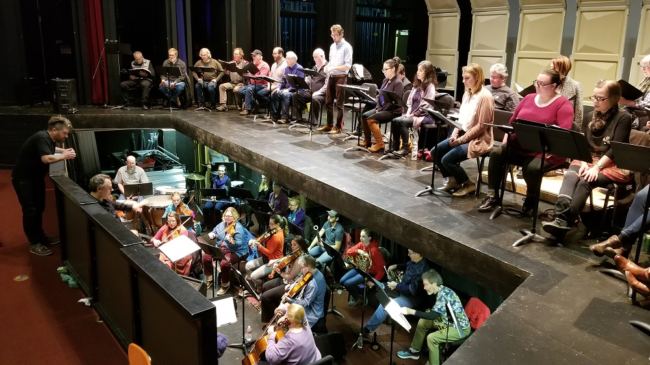 Composer Emerson Eads looks down into the orchestra pit. (Photo courtesy of Orpheus Project)
