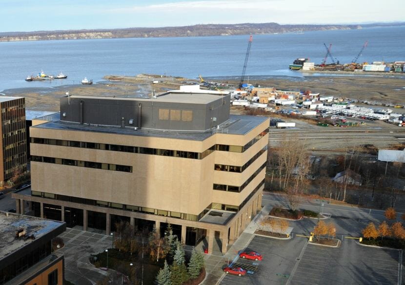 View looking northwesterly from the Hotel Captain Cook in Anchorage, Alaska. At left is the Boney Courthouse, the older of the two state courthouses in Anchorage, which houses the law library, magistrate courts and the chambers of the Alaska Supreme Court. The mouth of Ship Creek, Knik Arm and Point MacKenzie can be seen in the background.