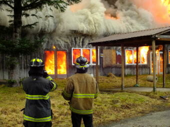 Capital City Fire/Rescue firefighters watch the Thane Ore House controlled burn on Nov. 24, 2018.
