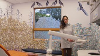 Pediatric dentist Kim Hort adjusts the dentist's chair in SEARHC's Juneau dental clinic where she works on Dec. 19, 2018. Hort says the vast majority of patients she sees are at high risk of cavities.