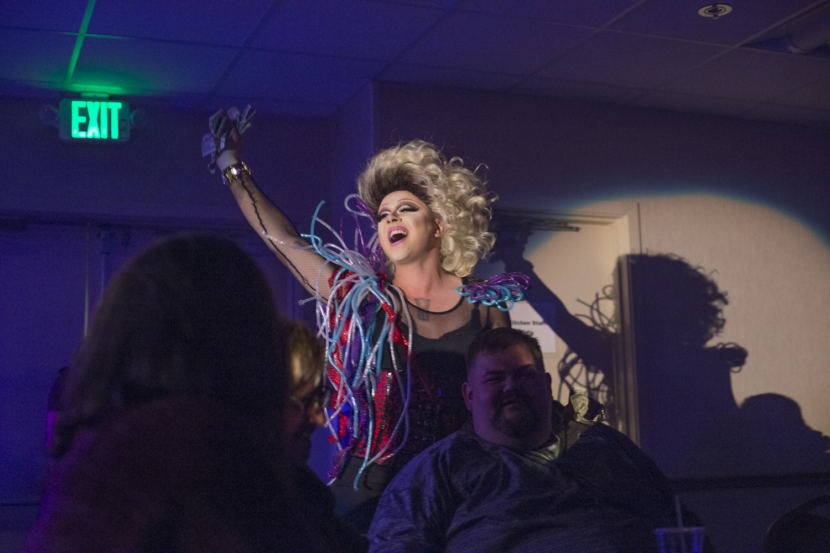 Dancing to Cyndi Lauper, Juneau artist Ricky Tagaban performs as the drag queen Lituya Hart greeting Tlingit & Haida President Richard Peterson at the “Besties for Breasties” drag show and medical fundraiser on September 21, 2018 at Elizabeth Peratrovich Hall in Juneau. The event may be the first drag show to be sponsored by a tribal government.