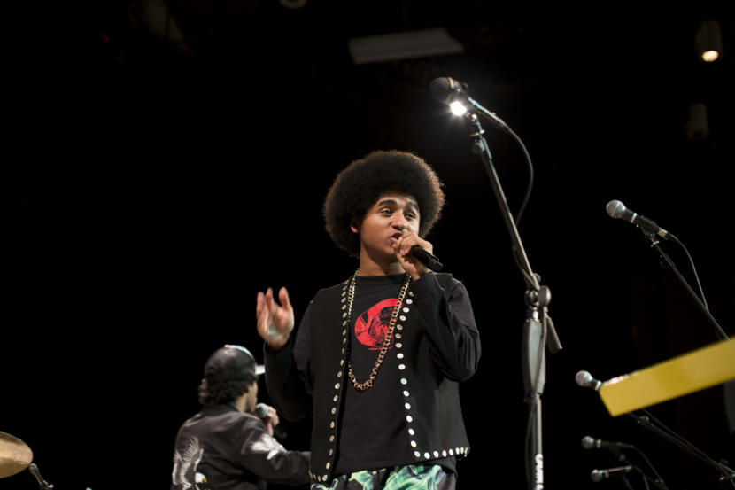 Juneau-Douglas High School: Yadaa.at Kalé senior Arias Hoyle raps as the opening artist for Khu.éex' at Centennial Hall on Monday, January 28, 2019. The Juneau MC has released two videos for his song "Zibit" and "Ix̱six̱án, Ax̱ Ḵwáan (I Love You My People)" sponsored by Tlingit and Haida’s Tribal Family and Youth Services department's Native Connections program. (Photo by Annie Bartholomew/KTOO)