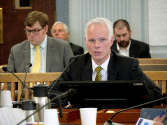 State Investment Officer Deven Mitchell of the Department of Revenue gives an overview of the state’s credit ratings and debt to the Senate Finance Committee in Juneau on Feb. 4, 2019.