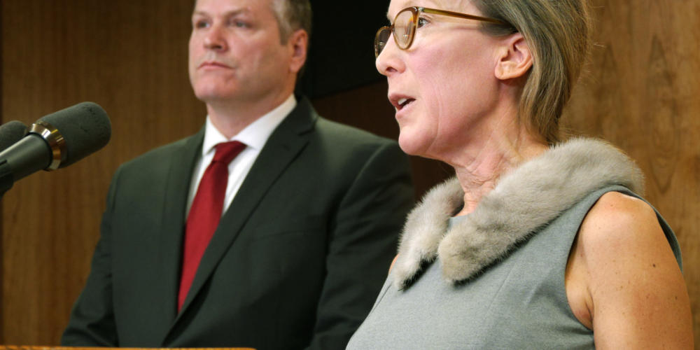 Office of Management and Budget Director Donna Arduin helps Gov. Michael Duleavy explain various aspects of his proposed state budget at a press availability in the Capitol in Juneau on Feb.13, 2019.