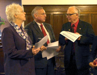 Reps. Louise Stutes, R-Kodiak, Bryce Edgmon, I-Dillingham, and Steve Thompson, R-Fairbanks, talk immediately following a Committee on Committees meeting in Juneau on Feb. 19, 2019.