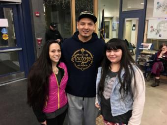 Rylee Rosson (right) and her parents at the Thunder Mountain High School information night on Jan. 23, 2019. Rosson said she's an arts and music person and might choose her high school for its theater program. (Photo by Zoe Grueskin/KTOO)
