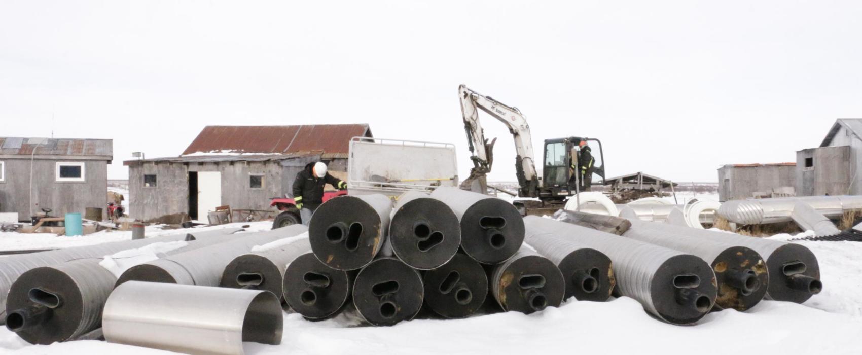 ANTHC crews prepare to bury water lines in Eek on February 20, 2019. (Photo by Anna Rose MacArthur/KYUK)