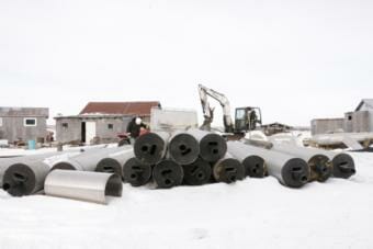 ANTHC crews prepare to bury water lines in Eek on February 20, 2019. (Photo by Anna Rose MacArthur/KYUK)