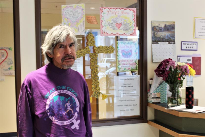 Matthew Fred Jr., who goes by J.R., stands in the lobby of the Housing First complex. (Photo by Adelyn Baxter/KTOO)