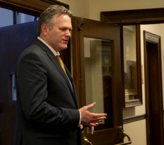 Gov. Mike Dunleavy talks with Sen. Lora Reinbold, R-Anchorage, in the 2nd floor hallway of the Capitol in Juneau on March 7, 2019. He had just left the House Speaker’s office.