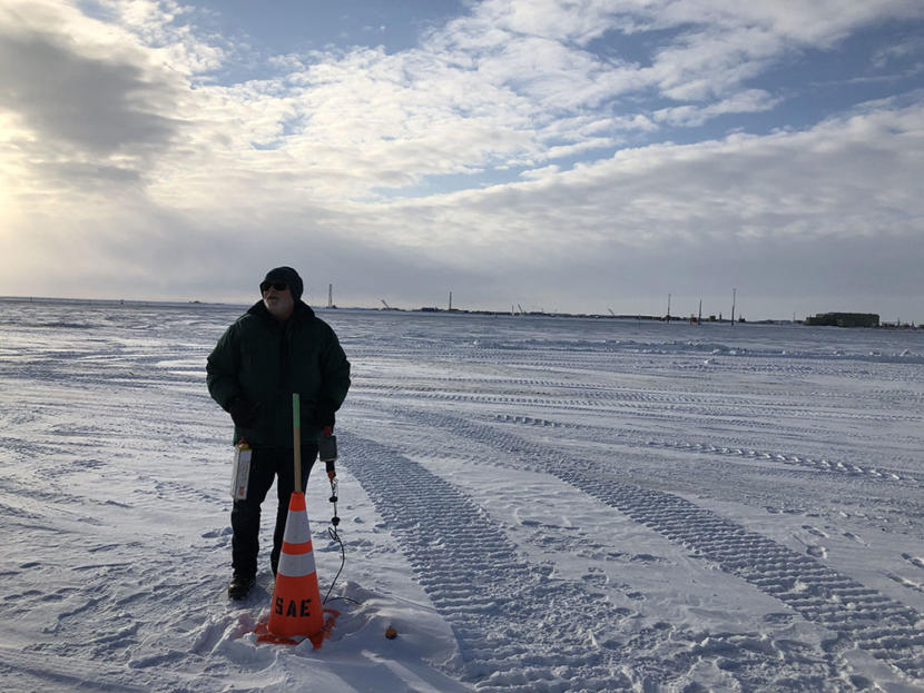 BP’s Richard Pool stands next to a receiver, which picks up sonic waves sent by the vibe trucks.